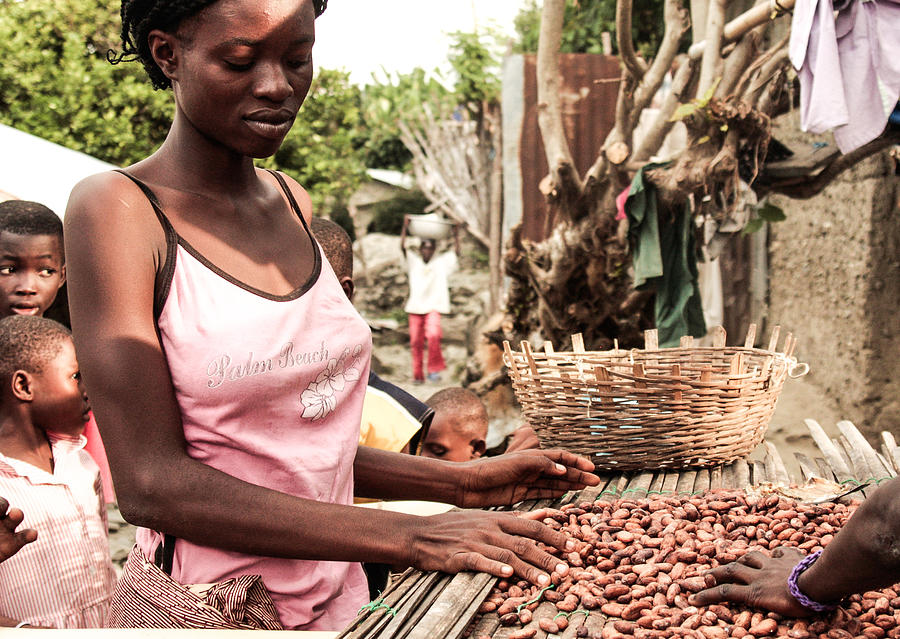 Young african woman selling nuts - Ghana, Africa Photograph by Sanjeri