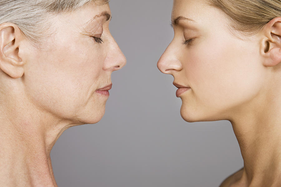 Young and senior women face to face Photograph by Image Source