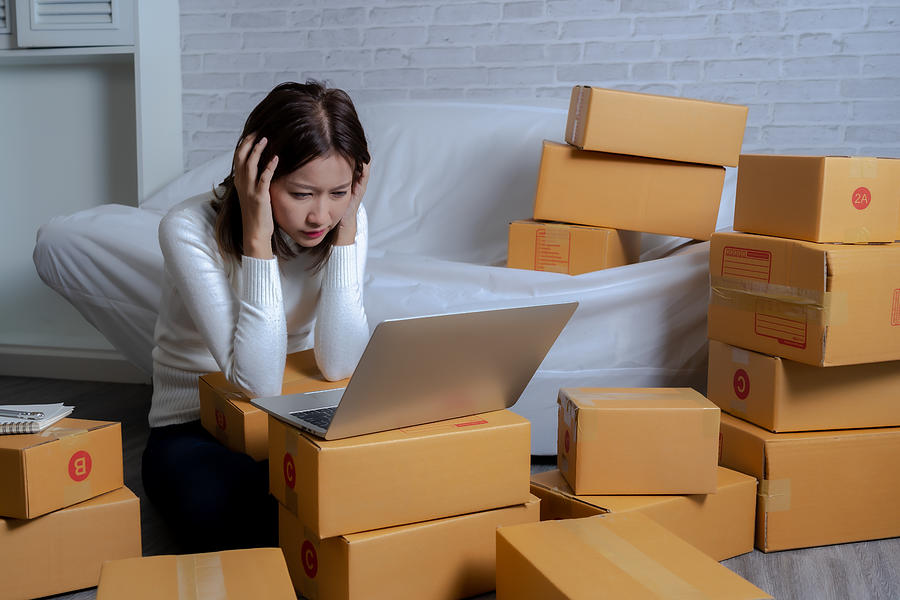 Young Asian women shop online  are stressed . After customers claim products Photograph by Moostocker