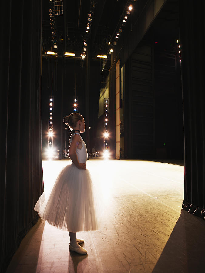 Young ballerina waiting in wings Photograph by Thomas Barwick