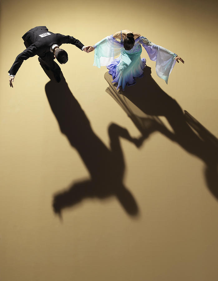 Young ballroom dancing couple bowing and curtseying, elevated view Photograph by Kelvin Murray