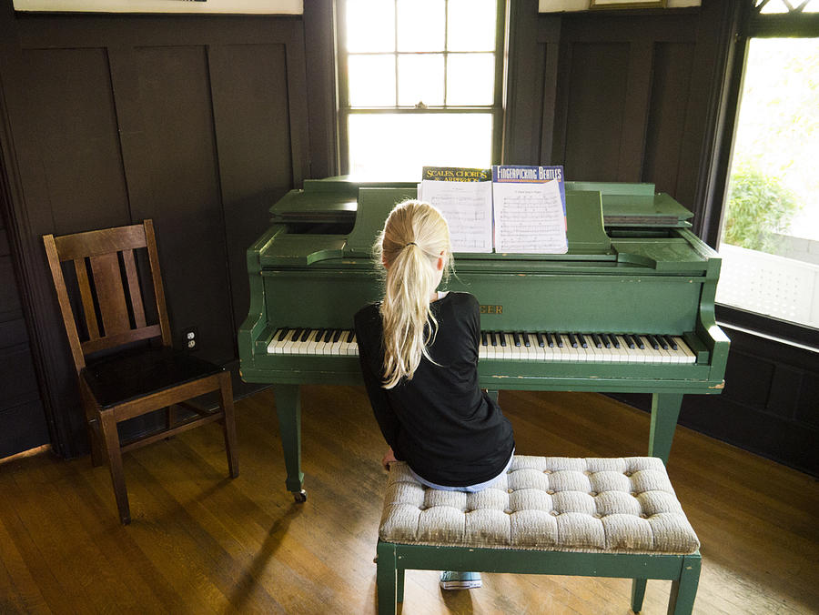Young Blonde Girl Playing Piano Photograph by Michael Edwards