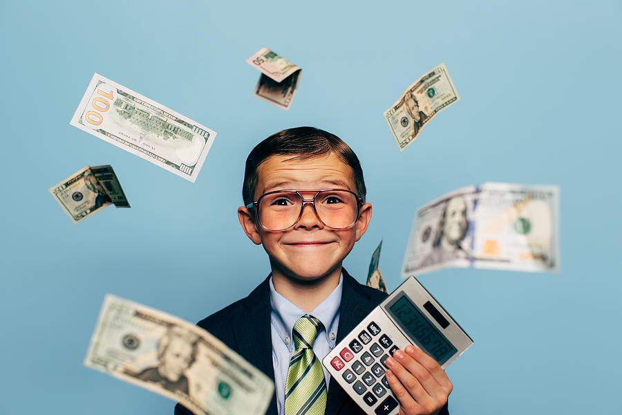 Young Boy Accountant Wearing Glasses holding Calculator Photograph by RichVintage