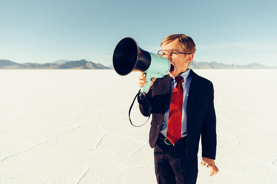 Young Boy Businessman Shouts Through Megaphone Photograph by RichVintage