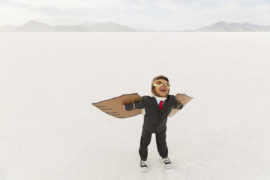 Young Boy Businessman Wearing Cardboard Wings Photograph by RichVintage