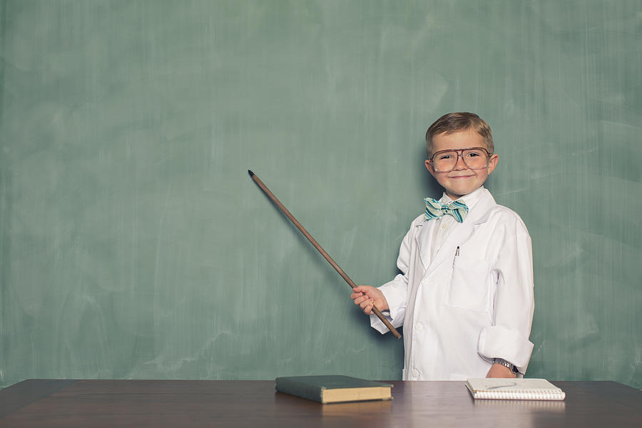 Young Boy Dressed as Scientist Points to Chalkboard Photograph by RichVintage