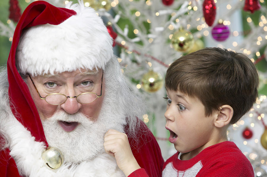Young Boy Pulls Santas Beard, Gasping With Surprise Photograph by Digital Vision.