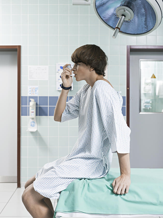 Young Boy Using Asthma Inhaler Photograph by Joos Mind