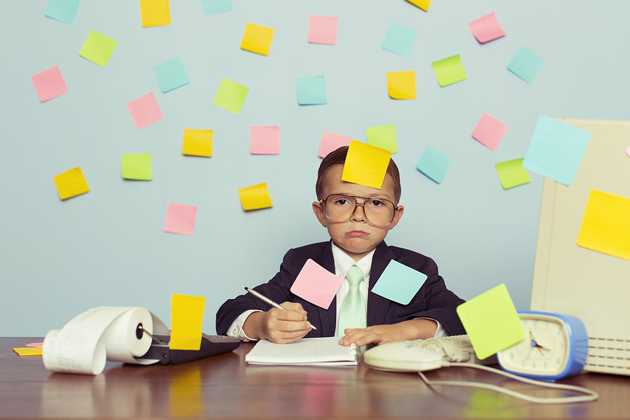 Young Businessman at Desk Covered with Blank Sticky Notes Photograph by RichVintage