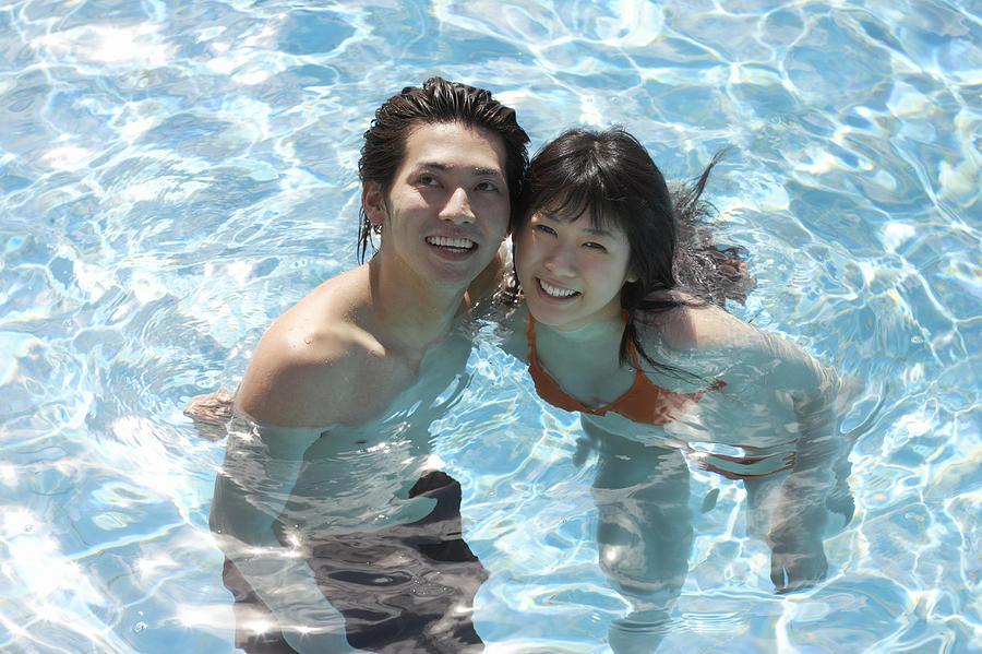 Young Couple in a Swimming Pool Photograph by Dex
