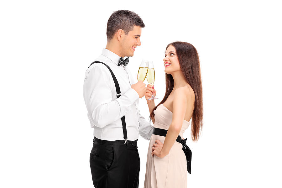 Young couple making a toast with wine Photograph by Ljupco