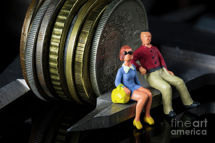 Young couple sitting on vernier caliper measuring coins stack. Retirement planning. money saving and investment. Time counting down for retirement Photograph by Pablo Avanzini