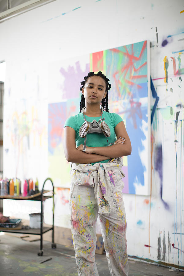Young female artist working in her studio Photograph by Alistair Berg