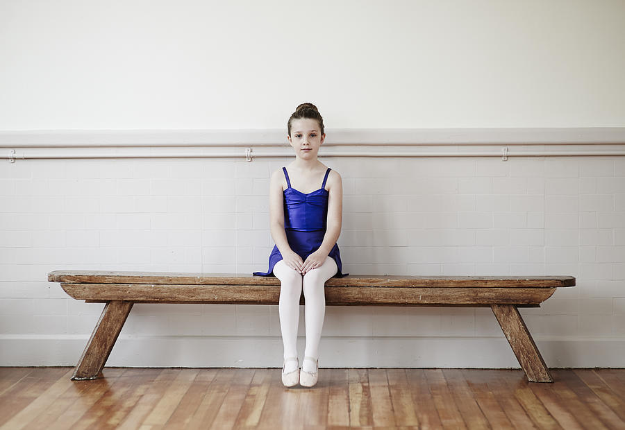 Young female ballet dancer on bench. Photograph by Mike Harrington