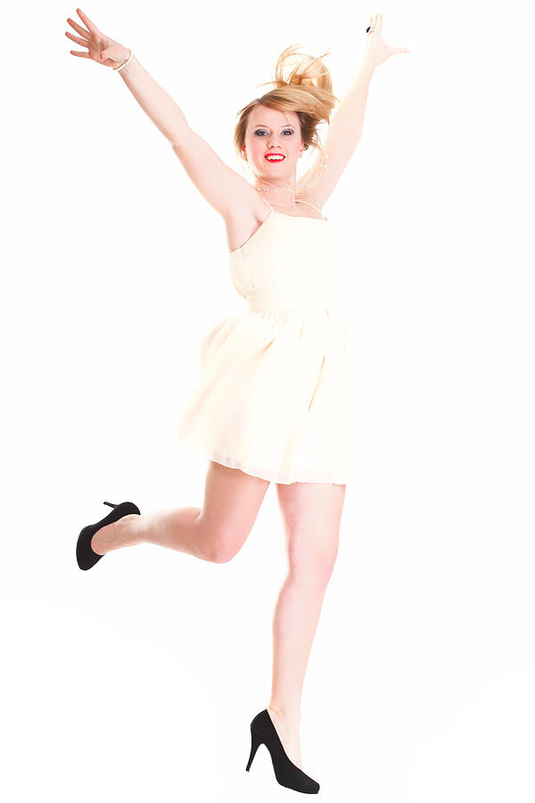 Young female Happy woman jumping with arms up isolated Photograph by Anetlanda