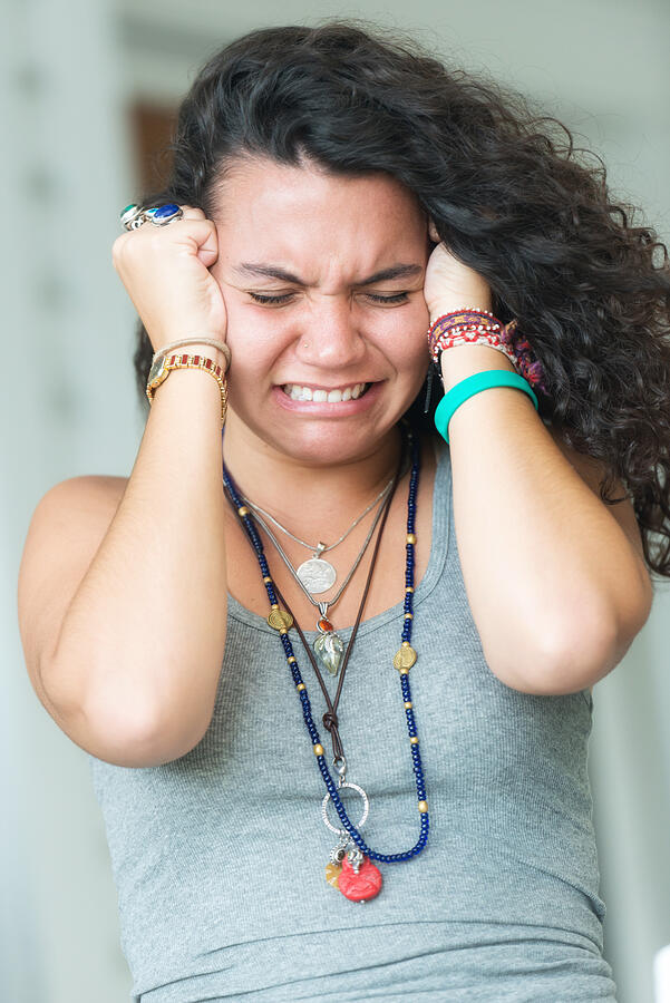 Young Frustrated  Curly Haired Woman Photograph by Juanmonino