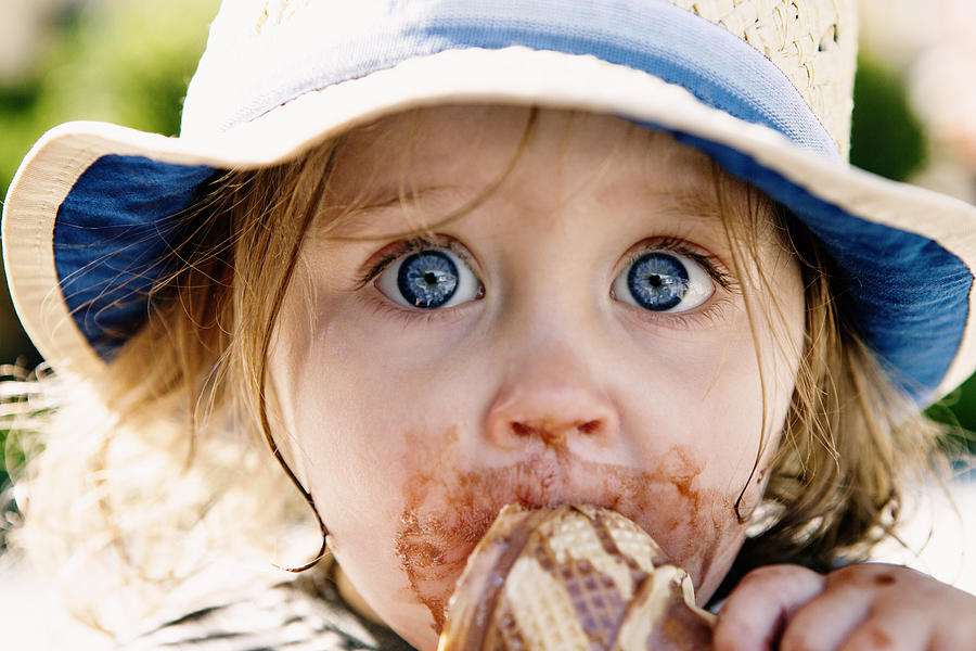 Young girl eating ice cream cone Photograph by Judith Wagner Fotografie