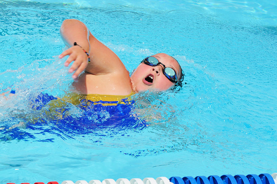Young Girl Freestyle Swimmer Racing in Pool for Exercise Fitness Photograph by Purdue9394
