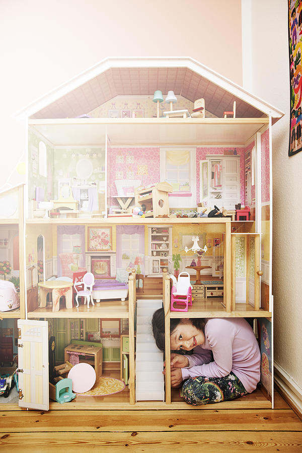 Young Girl Inside A Giant Dollhouse Photograph by Henrik Sorensen
