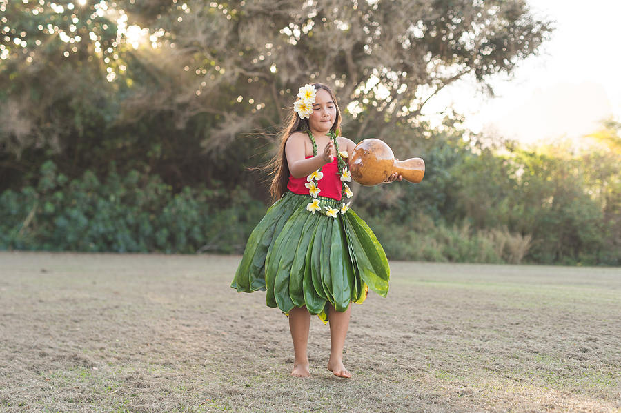 Young girl practicing hula outside Photograph by FatCamera