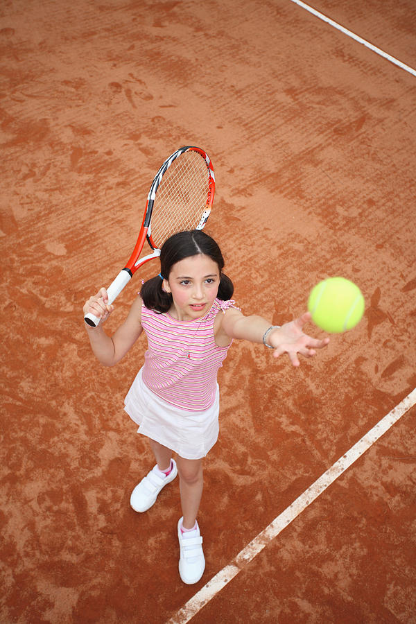 Young Girl Serve The Tennis Ball Photograph by Enrico Calderoni