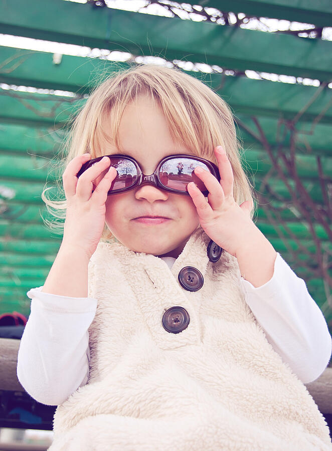Young girl wearing sunglasses upside-down Photograph by Teresa Short