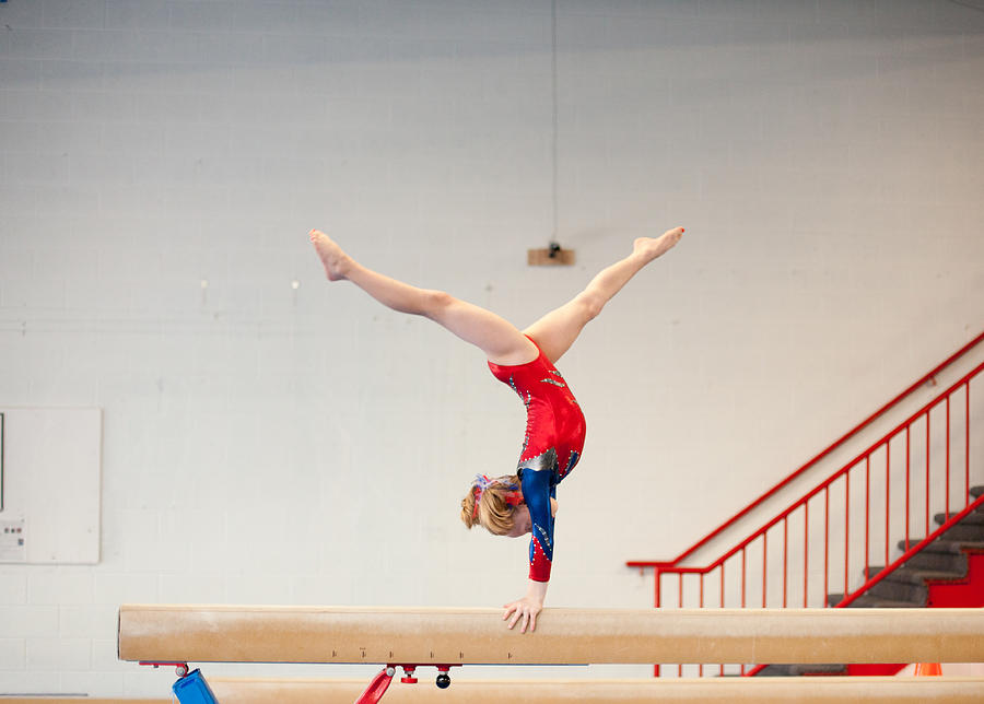 Young Gymnast in Handstand Split on Balance Beam Photograph by Ssj414