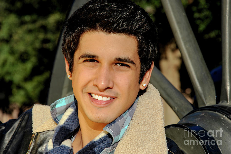  Young handsome hispanic male gives a beautiful smile that warms the cold winters day. Photograph by Gunther Allen