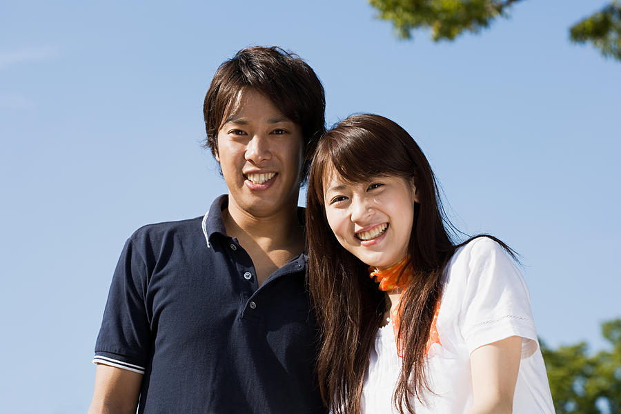 Young japanese couple Photograph by Image Source