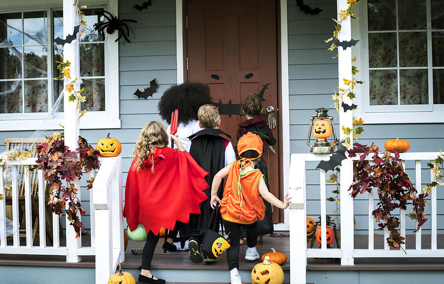 Young kids trick or treating during Halloween Photograph by Rawpixel