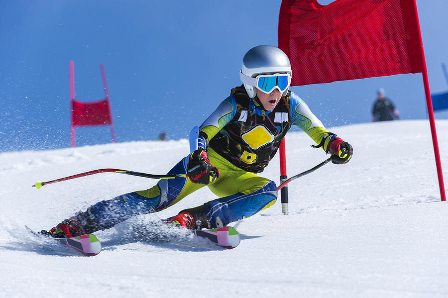 Young Male Skier Passing the Red Gate, Giant Slalom Race Photograph by Technotr