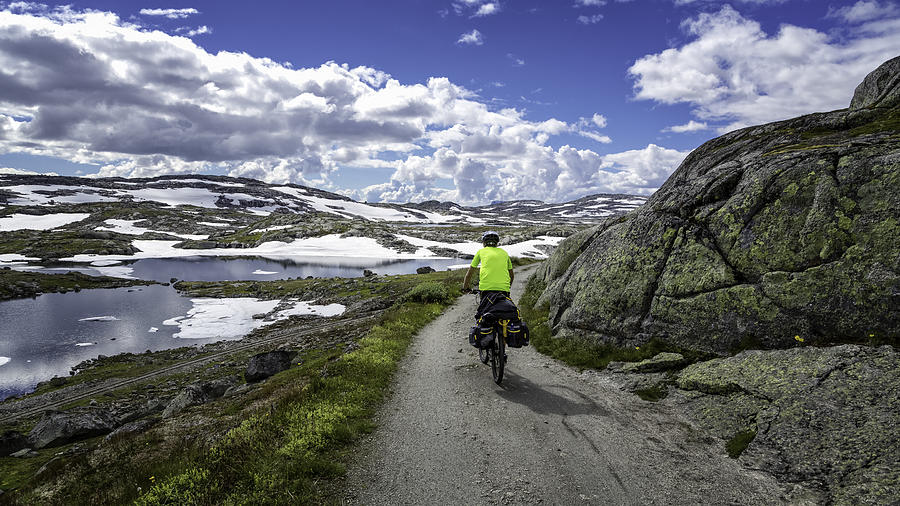 Young man bicycles Rallarvegen Photograph by Runar Vestli