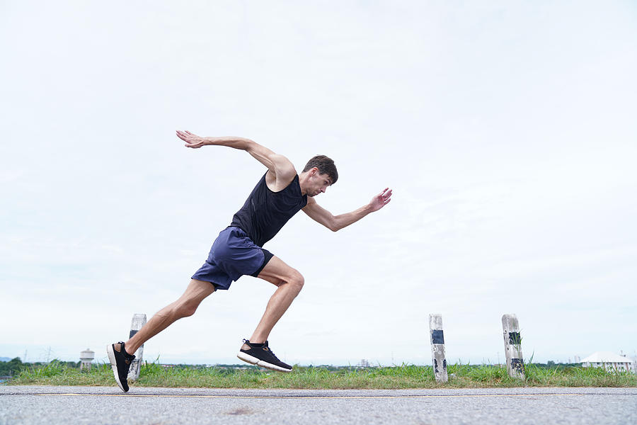 Young man doing speed running Photograph by wera Rodsawang