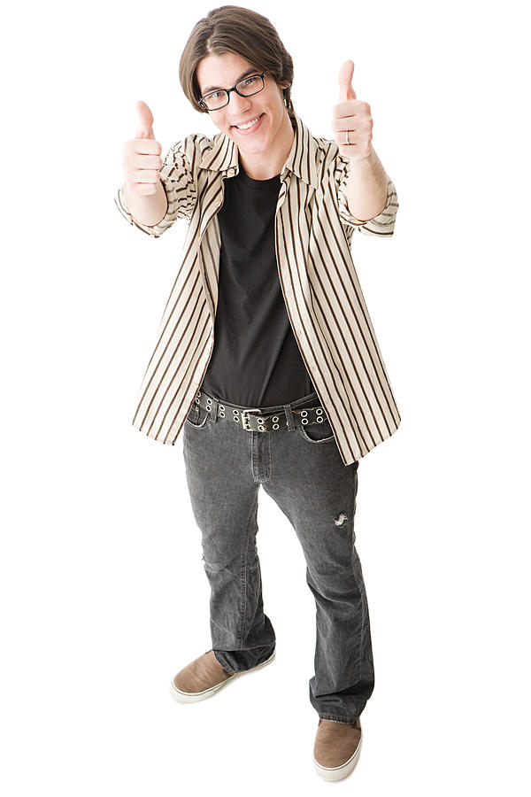 Young man giving thumbs up Photograph by Image Source