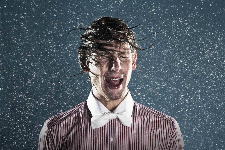 Young man in rain Photograph by Buena Vista Images