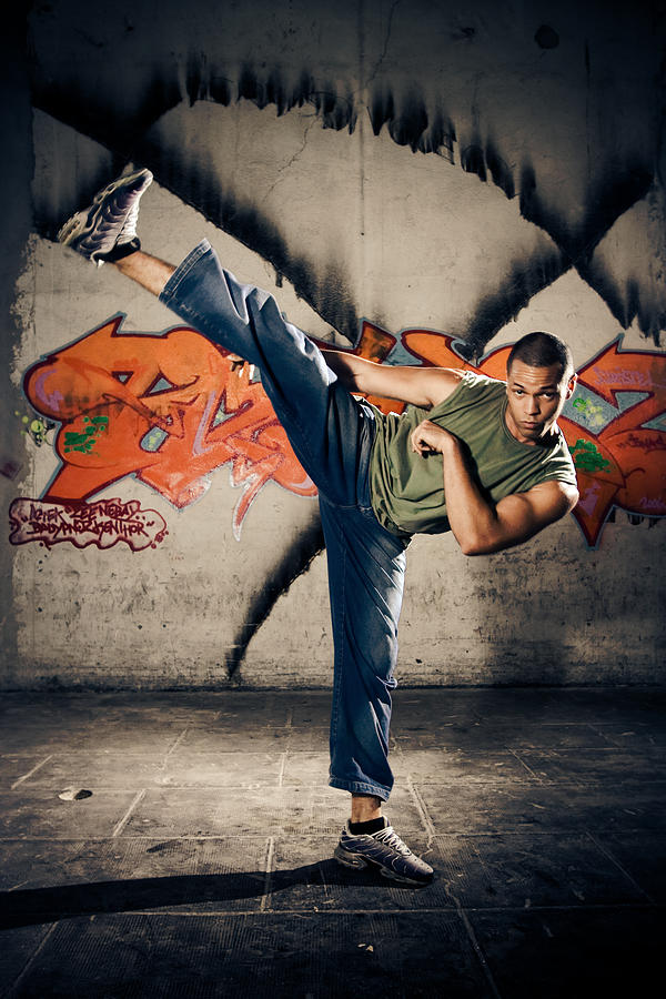 Young Man Kickboxing Photograph by Izusek