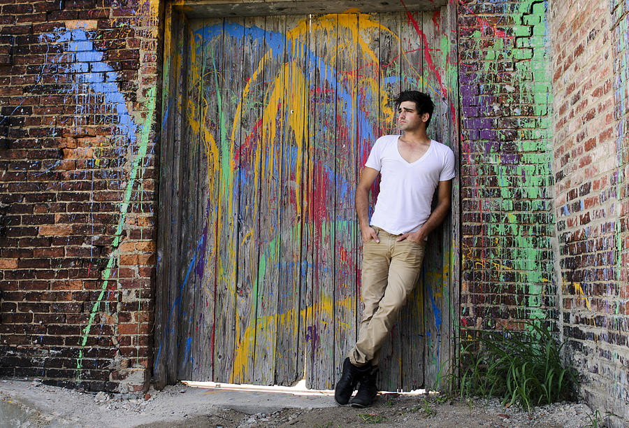 Young Man on Paint-Splattered Door Photograph by Mrod