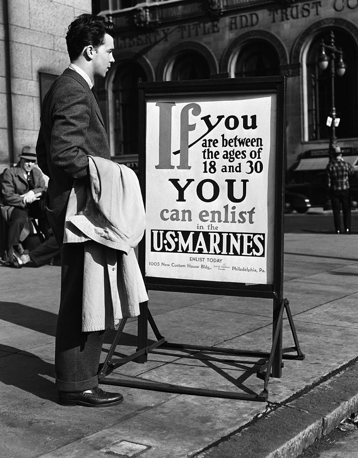 Young man reading US Marines recruitment post. (Photo by H. Armstrong Roberts/Retrofile/Getty Images) Photograph by H. Armstrong Roberts