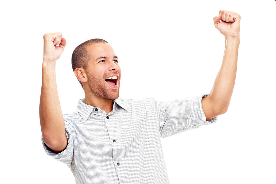 Young man screaming in excitement over white background Photograph by GlobalStock