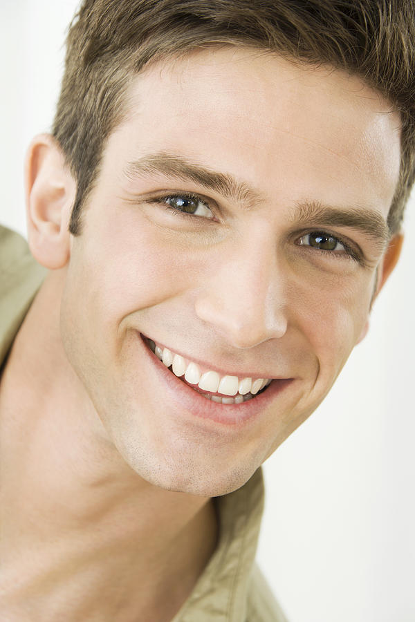 Young man smiling, portrait Photograph by Pando Hall