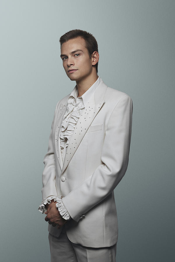 Young man wearing 70 white suit and puffy shirt Photograph by Klaus Vedfelt