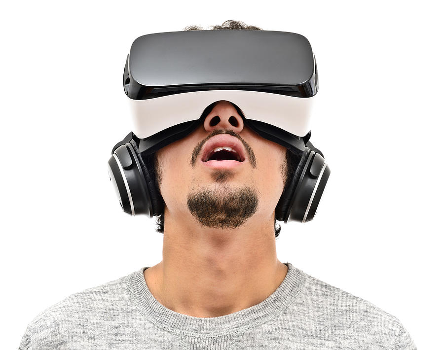 Young man wearing vr headset Photograph by Hocus-focus