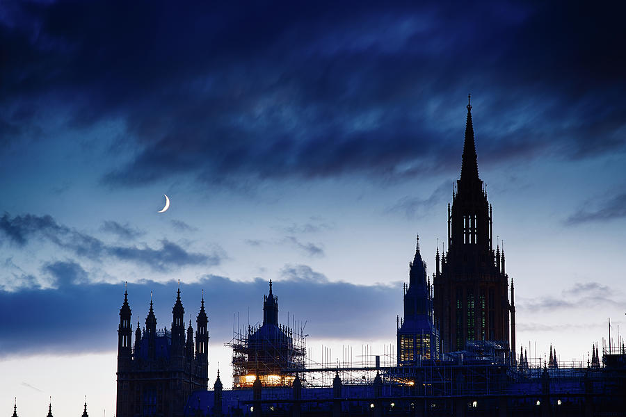 Young Moon over UK Parliament Photograph by Eugene Nikiforov