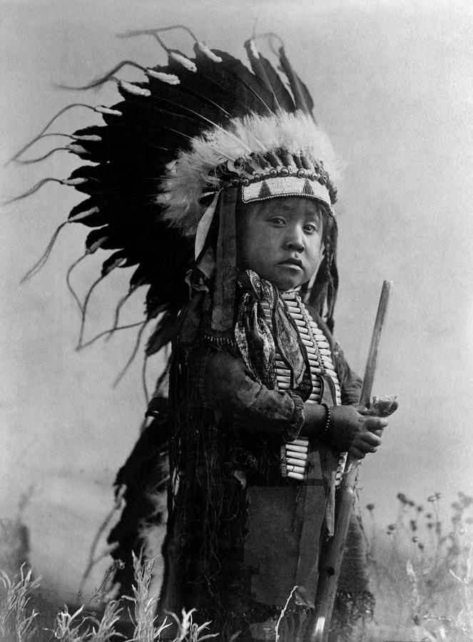 Young Native American In Full Headdress - Richard Throssel - Circa 1907 Photograph by War Is Hell Store