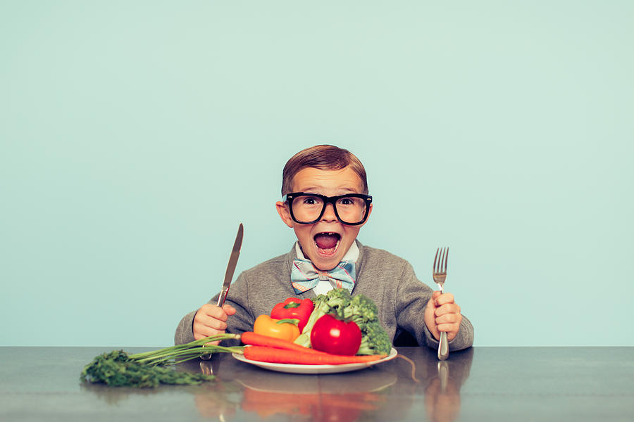 Young Nerd Boy Loves Eating Vegetables Photograph by RichVintage