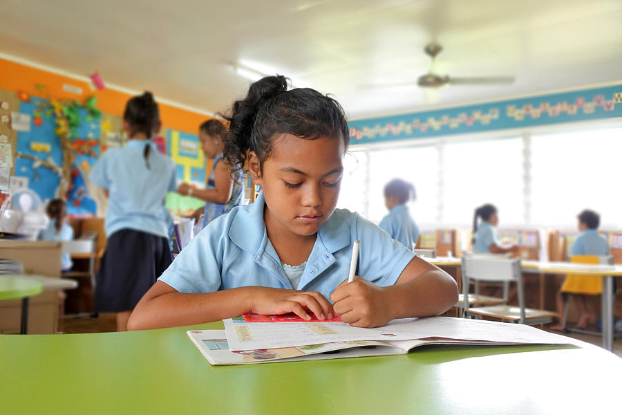 Young Pacific Islander girl study in school in Rarotonga Cook Islands Photograph by Rafael Ben-Ari