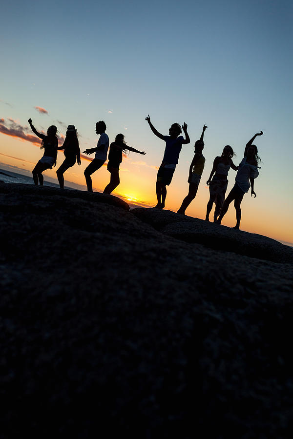 Young Party People Dancing On A Rock Photograph by Wundervisuals