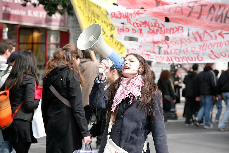 Young protestor with megaphone Photograph by Vasiliki
