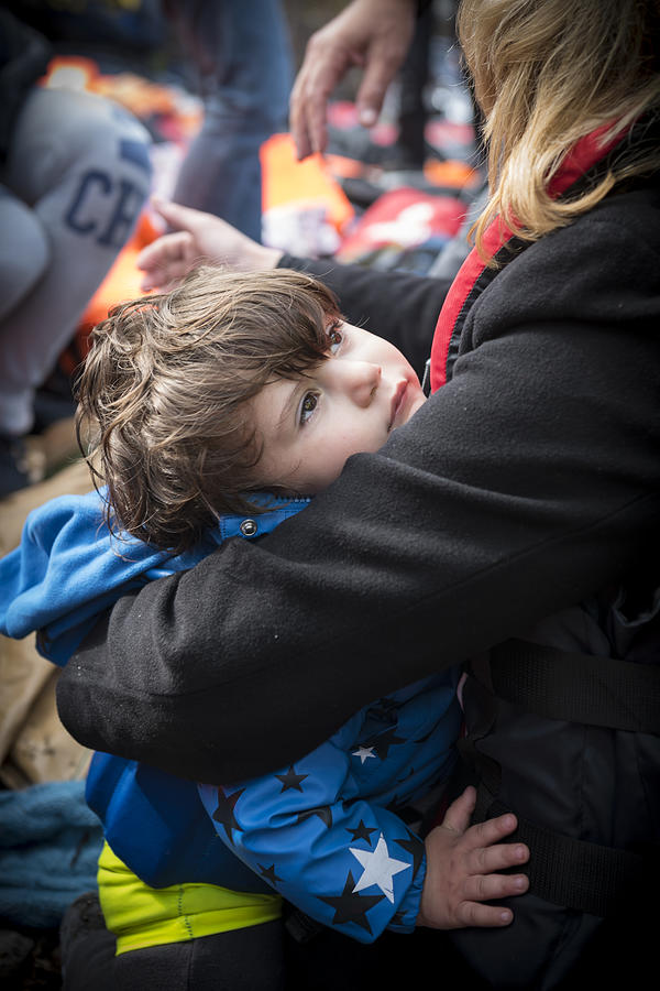 Young refugee arriving in Europe - Lesbos, Greece Photograph by Joel Carillet