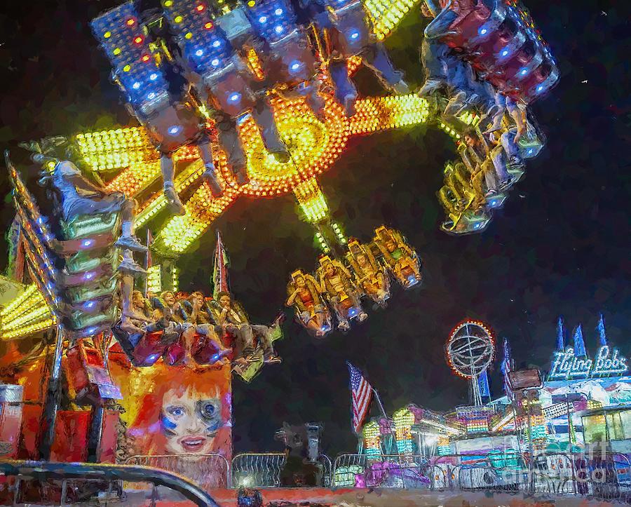 Young riders on a Spin Out amusement ride at the Montgomery County Fair